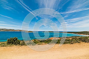 Blue sky over Capo Coda Cavallo shoreline