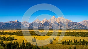 Blue sky over the majestic mountain peaks of Grand Teton National Park