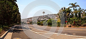 Blue sky over Pacific Coast Highway road heading into Laguna Beach