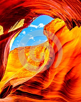 Blue Sky over the smooth Red Navajo Sandstone walls of Owl Canyon, one of the famous Slot Canyons in the Navajo lands near Page