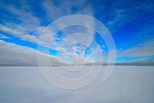Blue sky over a snowy field