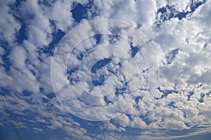 Blue sky with peacefull cotton clouds photo