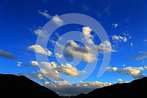 Blue sky with peacefull cotton clouds in Qinghai Tibet Plateau