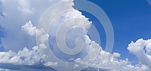 Blue sky and puffy clouds background. Cloudscape view full of natural light background. Cloud patterns.