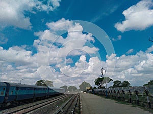 Blue sky railway station train clouds environment nature beautiful weather prakirti