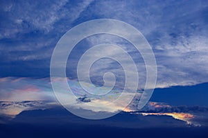 Blue Sky With Rainbow and Sun Reflection.