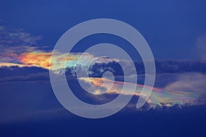 Blue Sky With Rainbow and Sun Reflection.