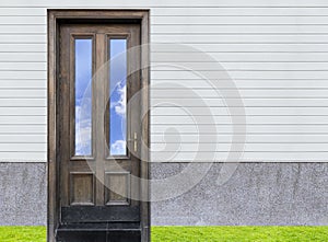 blue sky of reflec on mirror oak wood door and white wooden wa photo