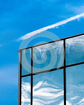 Blue sky reflection on building windows