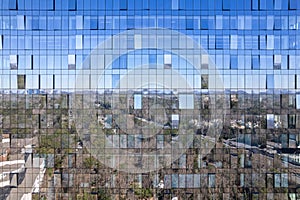 Blue sky reflection on a modern office building