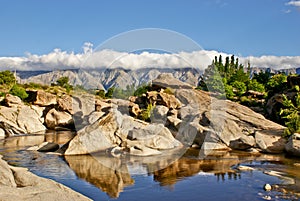 Blue sky and river rocks