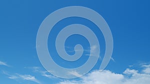 Blue sky soft silky clouds. Background of sky and clouds. Cirrus clouds in blear bright summer day. Time lapse.