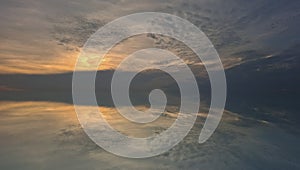 Blue Sky and Soft Sunset Over Calm Horizon