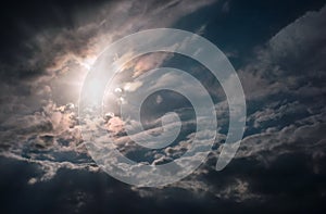 Blue sky with sun and clouds