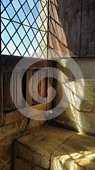 Sunlight shining through old window