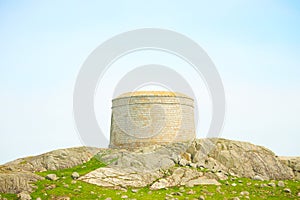 Blue sky and sunny day with Fort, Martello tower, Saint Begnet`s Church on Dalkey Island, County Dublin, Ireland.