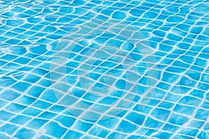 Blue sky swimming pool water texture reflection.