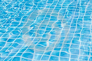 Blue sky swimming pool water texture reflection.