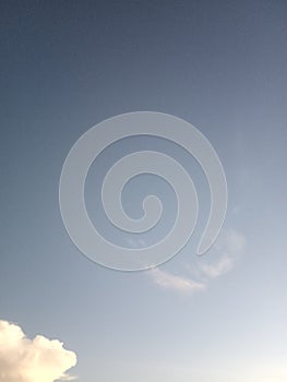 Blue sky with thin cumullus cloud