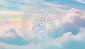 Blue sky and white cloud background with a pastel colored gradient.
