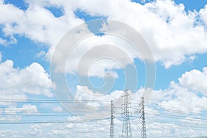 Blue sky and white cloud with high voltage transmission towers and power line