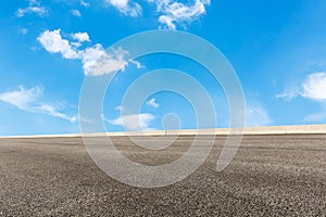 Blue sky white clouds and asphalt road