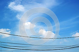 Blue Sky with White Clouds and Dangling Wires