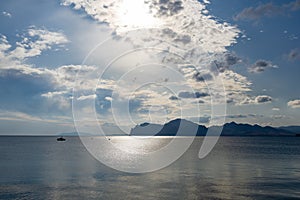 Blue sky with white clouds over the sea and mountains. Two Anchor Bay in Ordzhonikidze, Crimea