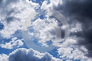 Blue sky with white clouds. Thickening clouds in the daytime sky. Abstract background