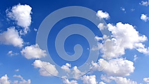 Blue sky with white fluffy clouds. Freedom of life concept.