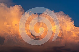 Blue sky and white fluffy clouds on sunset sky. White cumulus clouds. Dramatic sky and clouds abstract background. Warm weather