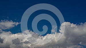 blue sky with white and grey clouds