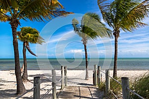 Blue sky with white sand and palm beach in Key West