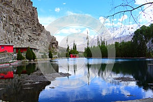 Blue sky wonderful reflec on water. This place so beautiful called natural lake in gilgit baltistan pakistan