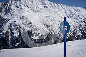 Blue slope sign in the mountains