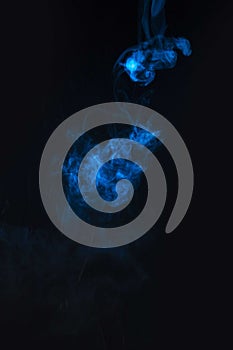 Blue smoke against black background. High quality and resolution beautiful photo concept