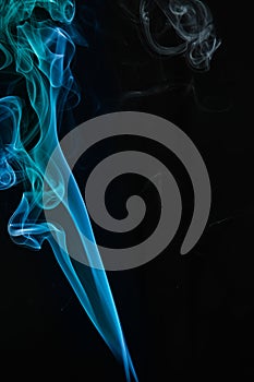 Blue smoke on black background