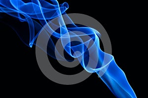 Blue smoke on the black background.