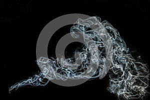 Blue Smoke and dust on black background