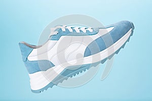 Blue sneaker blue background