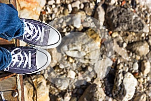 Blue sneakers on the beach