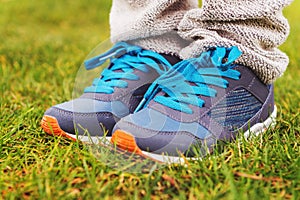 Blue sneakers on child's feet