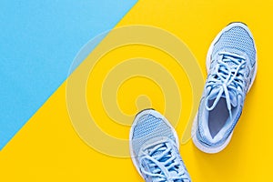 Blue sneakers isolated on colorful background