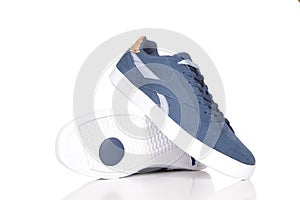 Blue sneakers isolated on white background,a pair of blue sneakers for jeans