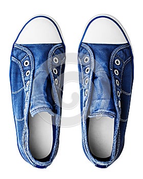 Blue sneakers white background isolated close up top view, stylish rubber gumshoes without laces, pair of sport denim shoes