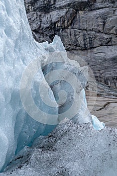 Blue snow glacier vertical view. Norway mountains