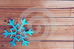 Blue snowflake on wooden board special edition for winter season