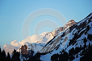 Blue Snowy Mountain Peaks with Clouds in Lec, Austria