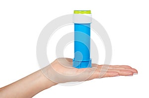 Blue soap bubble bottle with hand isolated on white background