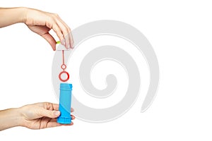 Blue soap bubble bottle with hand isolated on white background, copy space template